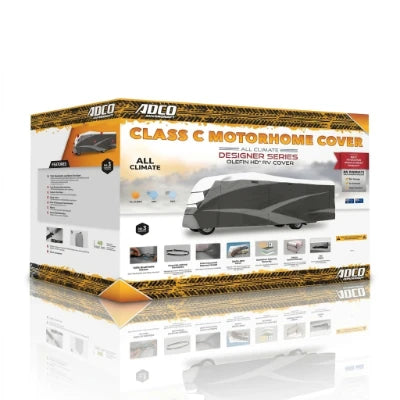 A boxed product package for an ADCO Class C motorhome cover, shown on a clean white background. The box is mostly white with orange and yellow branding, a large photo of a gray motorhome covered by the product, and several small feature icons along the bottom.